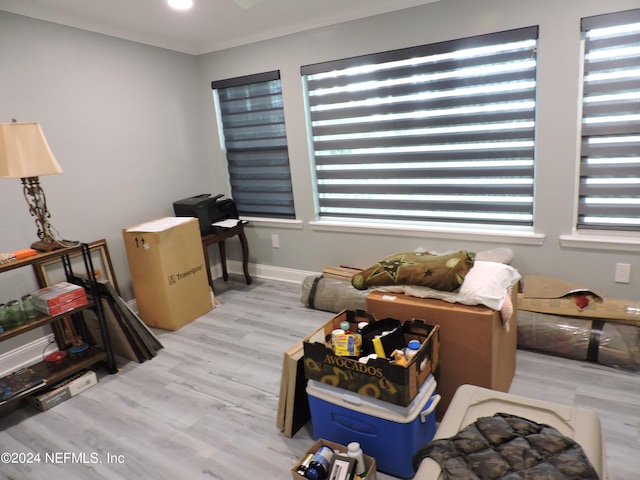 interior space featuring crown molding and hardwood / wood-style flooring