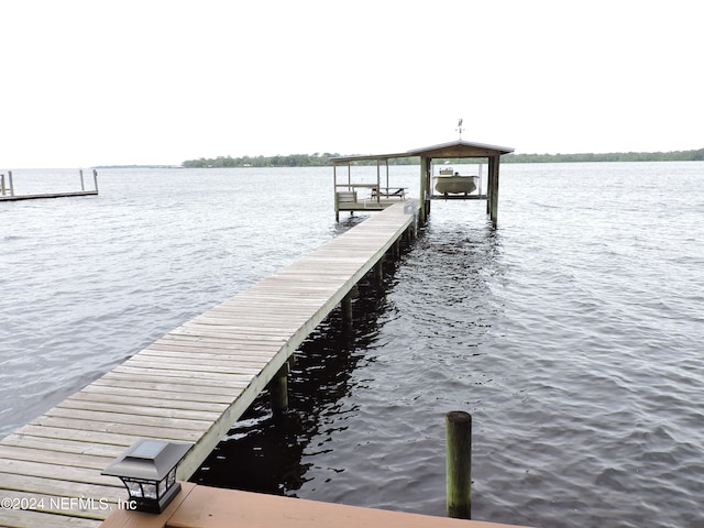 dock area featuring a water view