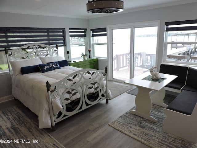 bedroom featuring access to outside and hardwood / wood-style floors