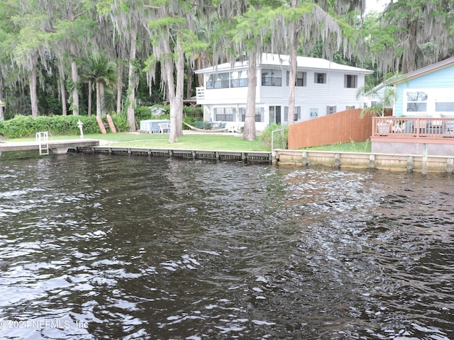 view of dock featuring a deck with water view