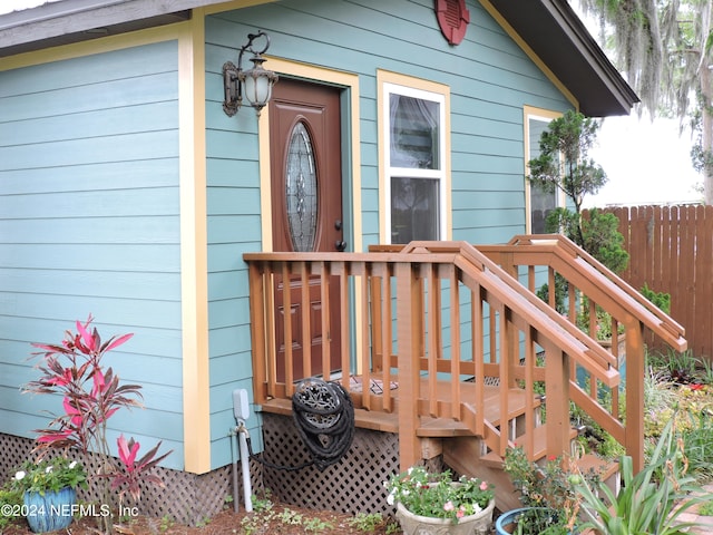 entrance to property with a deck