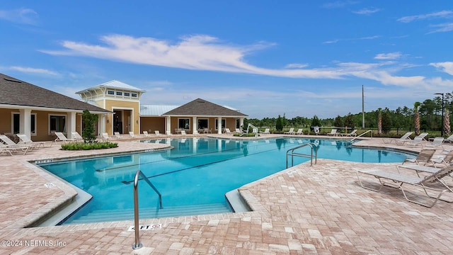 view of swimming pool with a patio area