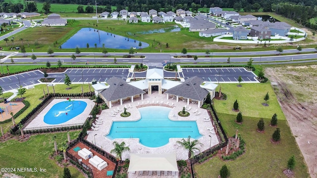 view of swimming pool featuring a water view