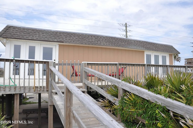 back of house featuring a deck