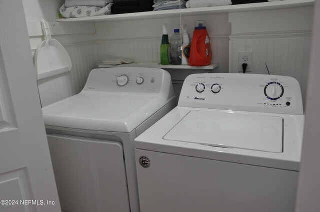 washroom with independent washer and dryer