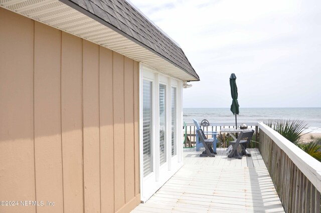 wooden deck with a water view