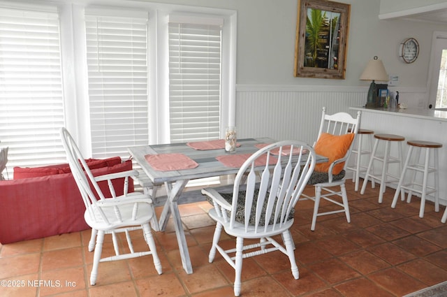 dining space with tile patterned floors