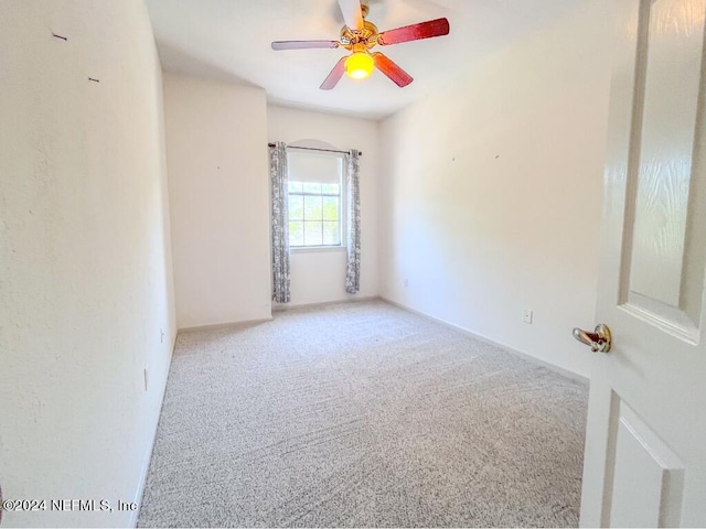 empty room featuring carpet and ceiling fan