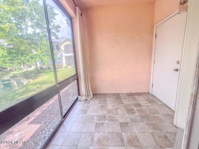 unfurnished sunroom with a healthy amount of sunlight