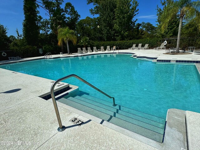 1414 Vista Cove Rd, Saint Augustine, FL 32084 - pool with a patio area and fence
