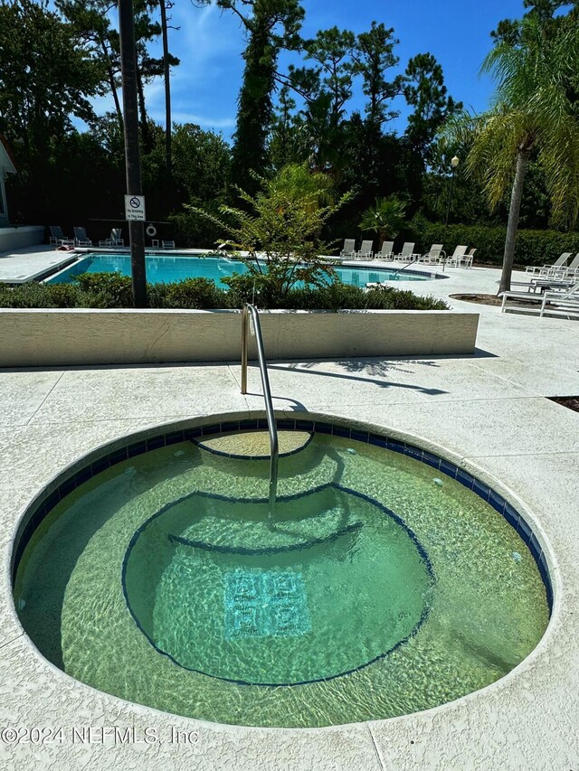 view of property's community with a swimming pool