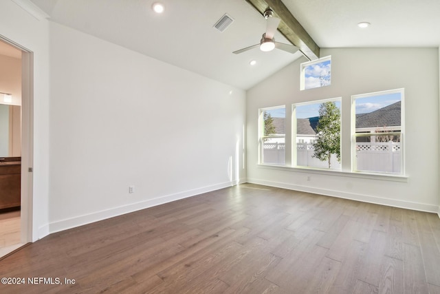 spare room featuring hardwood / wood-style floors, vaulted ceiling with beams, and ceiling fan