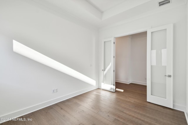 unfurnished room with hardwood / wood-style floors