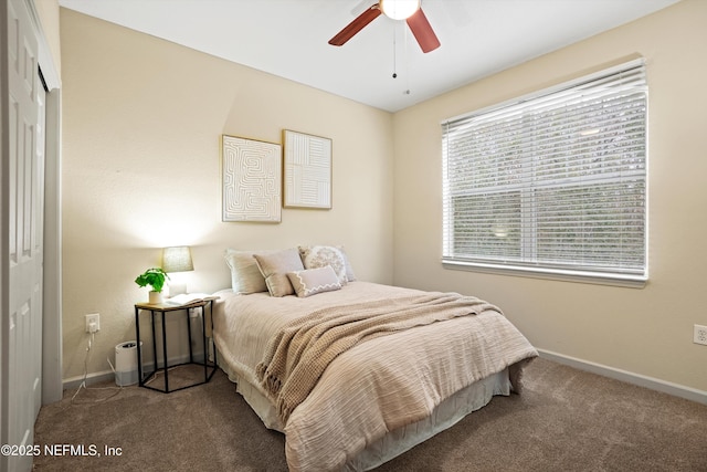 carpeted bedroom with ceiling fan and a closet