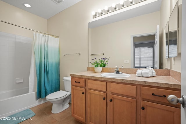 full bathroom featuring shower / bath combo with shower curtain, toilet, tile patterned floors, and vanity