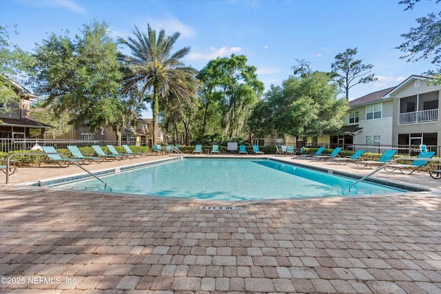 view of swimming pool with a patio