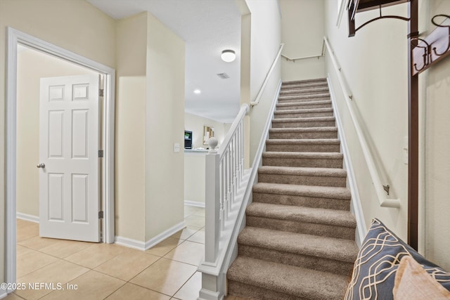 stairs with tile patterned flooring