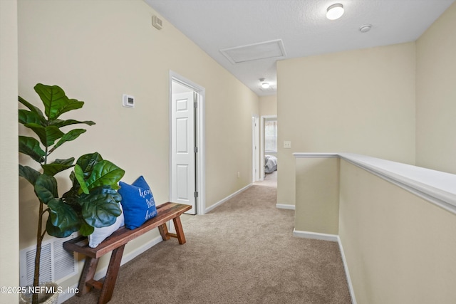 hallway with light colored carpet