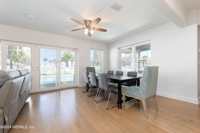 dining area with ceiling fan and light wood-type flooring