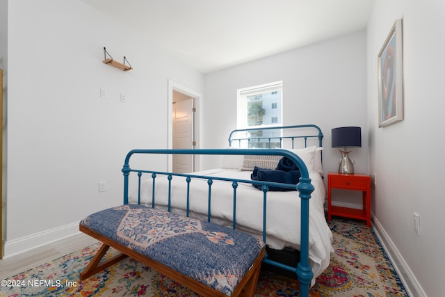 bedroom featuring hardwood / wood-style flooring