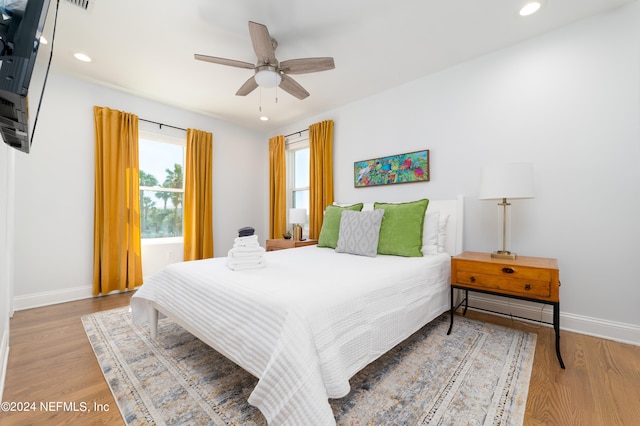 bedroom featuring ceiling fan and hardwood / wood-style flooring