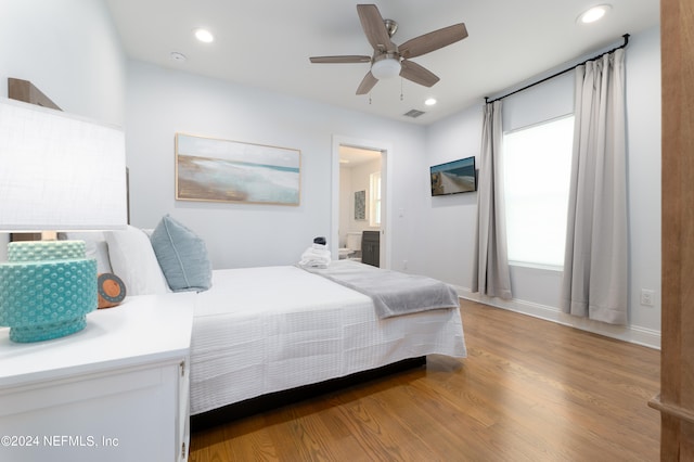 bedroom featuring light hardwood / wood-style flooring and ceiling fan