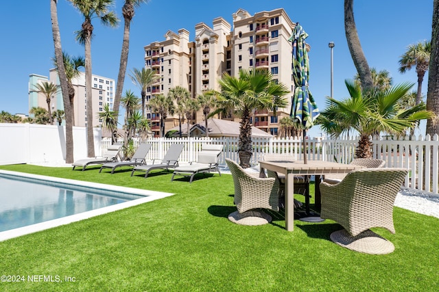 view of yard featuring a community pool