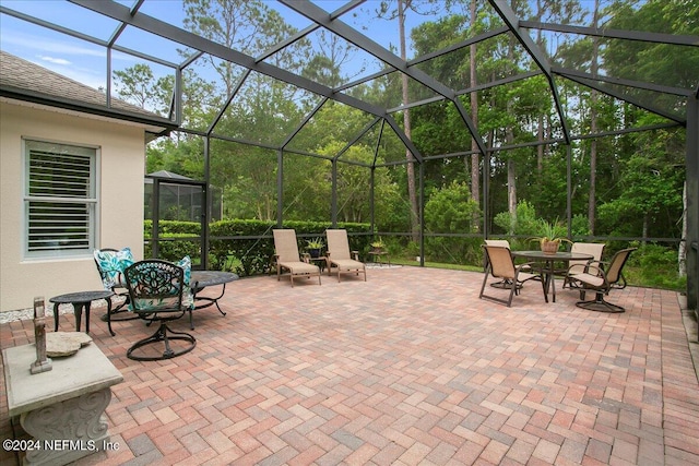 view of patio / terrace with a lanai