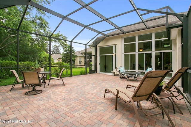 view of patio / terrace with a lanai