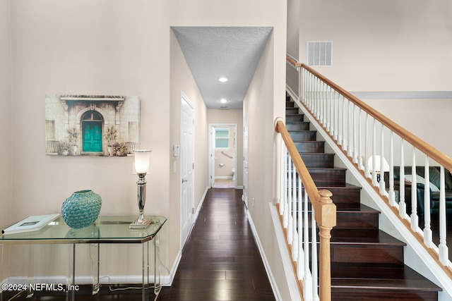 stairs with wood-type flooring