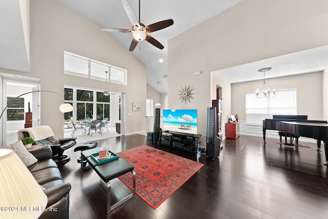 living room with ceiling fan with notable chandelier, high vaulted ceiling, and dark wood-type flooring