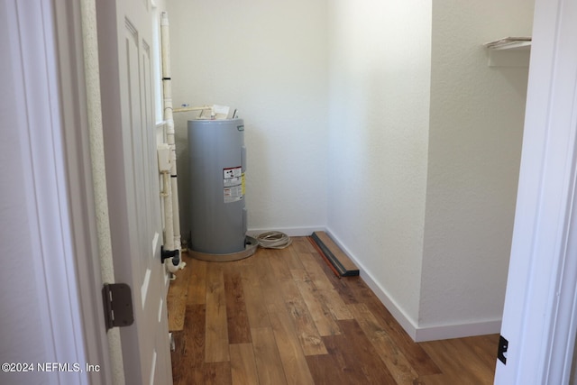 utility room featuring electric water heater