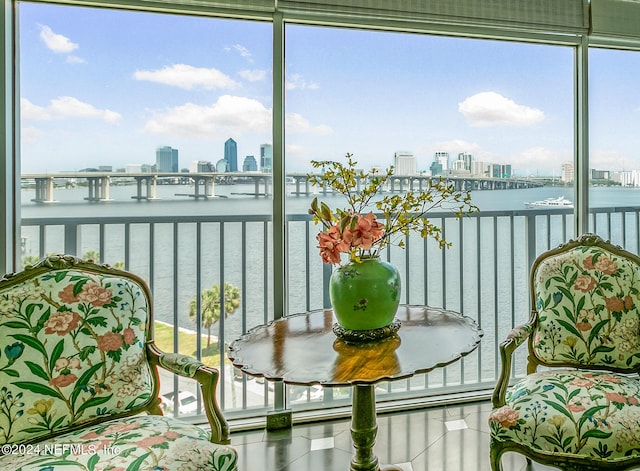 sunroom / solarium with a water view