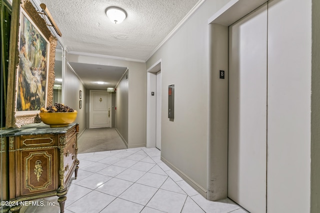 corridor with a textured ceiling, light tile patterned flooring, crown molding, and elevator