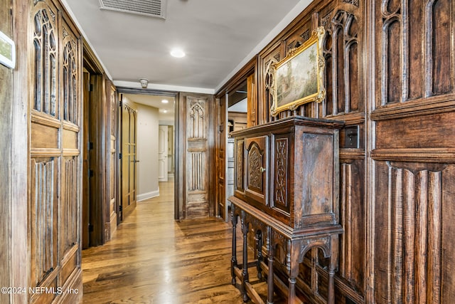 hall with hardwood / wood-style floors