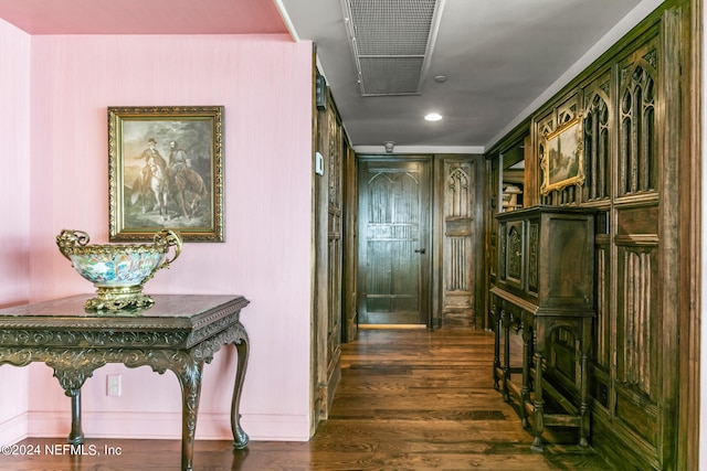 corridor featuring dark hardwood / wood-style floors