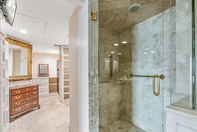 bathroom featuring vanity and an enclosed shower