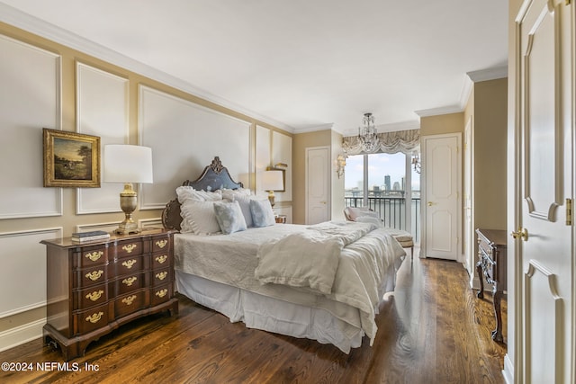 bedroom with access to outside, dark wood-type flooring, and ornamental molding