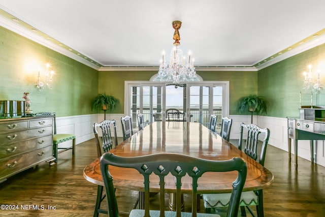 dining area featuring a chandelier, french doors, dark hardwood / wood-style flooring, and crown molding