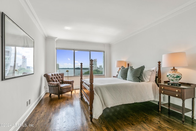 bedroom with dark hardwood / wood-style flooring, a water view, and crown molding