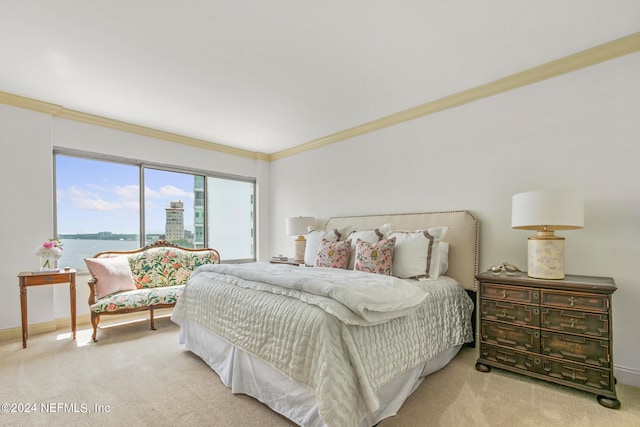 carpeted bedroom with a water view and crown molding