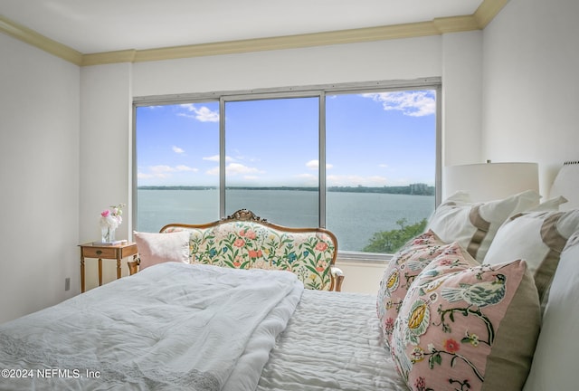 bedroom featuring a water view and crown molding