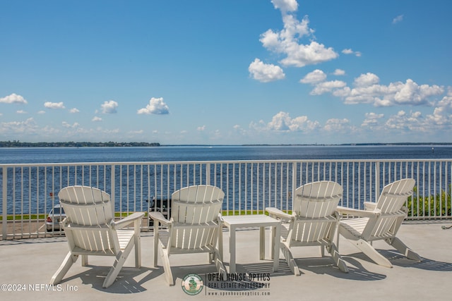 view of patio with a water view