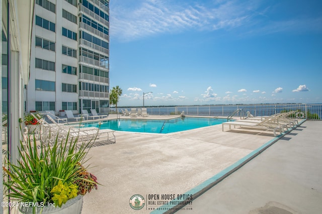 view of swimming pool with a patio