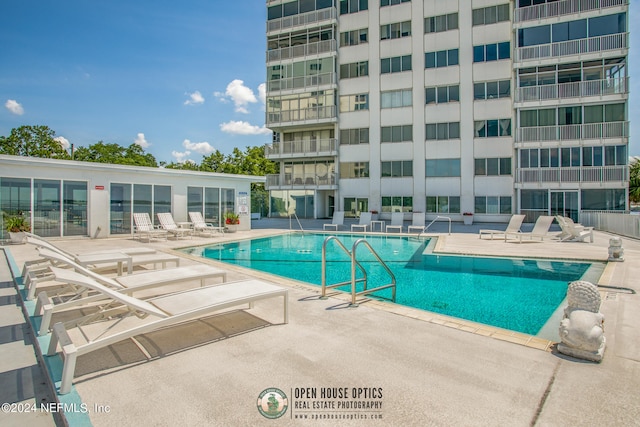 view of swimming pool featuring a patio area