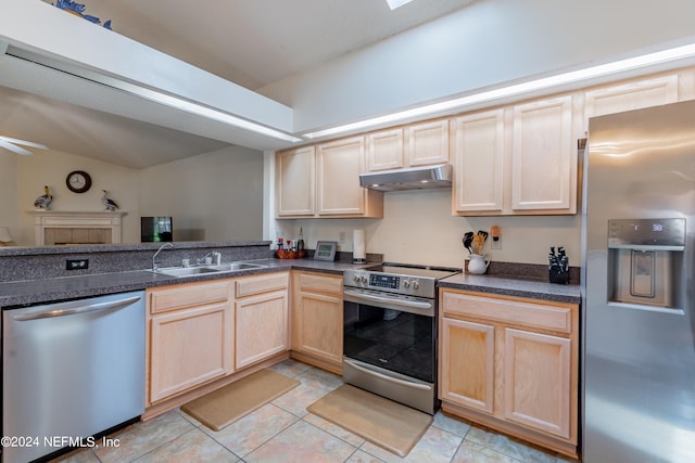 kitchen with sink, ceiling fan, light tile floors, and stainless steel appliances