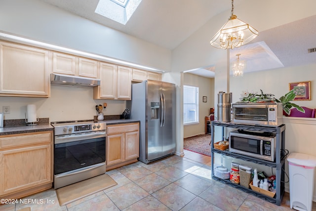 kitchen with stainless steel appliances, light brown cabinets, light tile floors, and decorative light fixtures