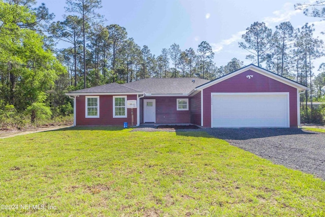 single story home with a garage and a front yard