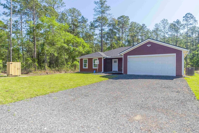 ranch-style home featuring a garage, central AC unit, and a front lawn