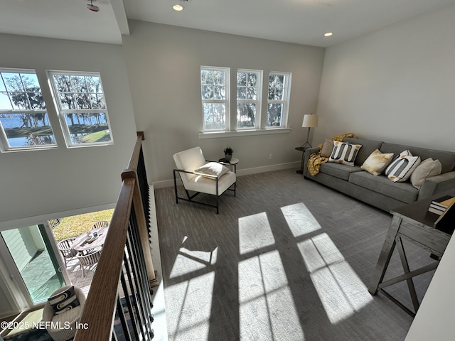 carpeted living room featuring baseboards and recessed lighting